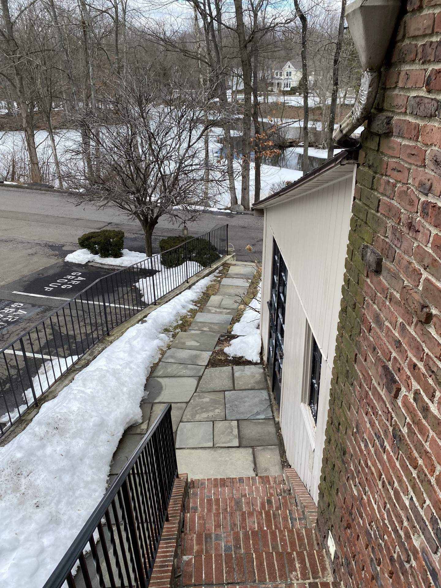 Exterior brick facade with stone detailing and arched entrance at The Phillips Mansion